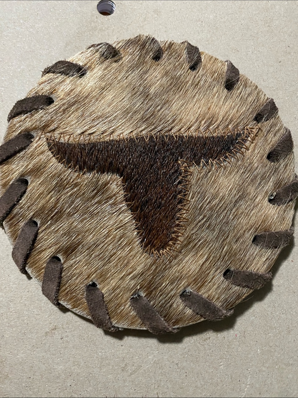 Handcrafted Brown Cowhide Round Accent with Dark Brown longhorn Patch-